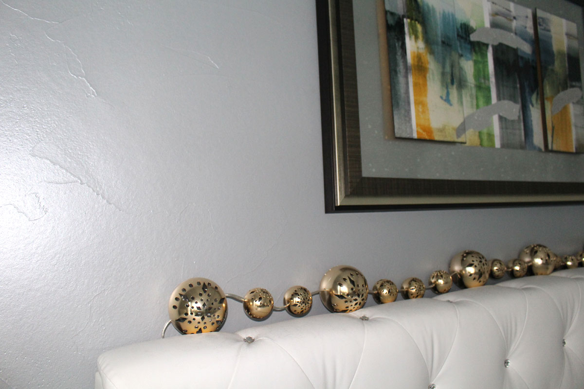Silver & Blue Hue Metallic Paint on Light Textured Wall